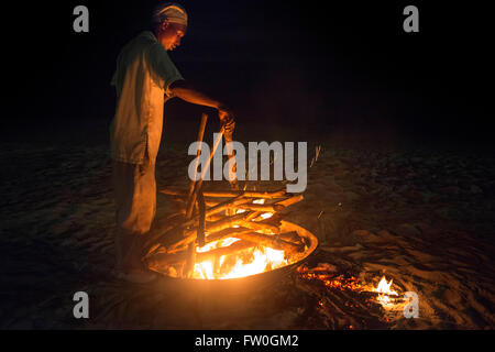 Fire for a barbecue in the beach of The Residence Hotel in Zanzibar island a semi-autonomous part of Tanzania, in East Africa Stock Photo