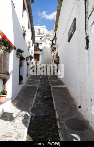 Traditional rugs hanging outside shopes in the Andalucian village of Pampaneira in the Alpujarras Stock Photo