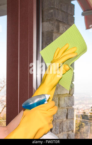 woman who washes the windows of the house Stock Photo