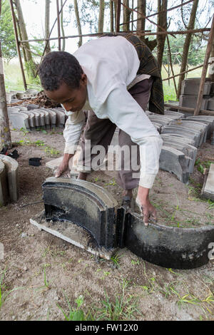 Debre Birhan, Amhara, Ethiopia, October 2013 Two young men making fuel efficient stoves at the EWNHS tree nursery. Stock Photo