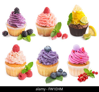 Collection of bright cupcakes with fresh berries isolated Stock Photo