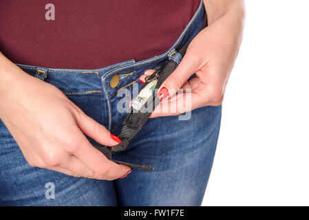 Money in a secret pocket of the belt. Isolated on white. Stock Photo