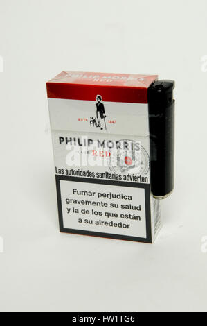Philip Morris Red Cigarettes with lighter on white background Stock Photo