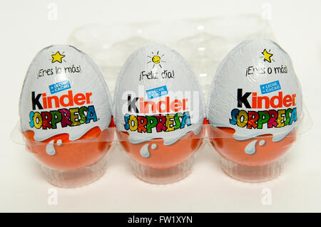 Kinder Surprise, also known as a Kinder Egg manufactured by Italian company Ferrero taken on white background. Stock Photo