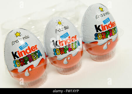 Kinder Surprise, also known as a Kinder Egg manufactured by Italian company Ferrero taken on white background. Stock Photo