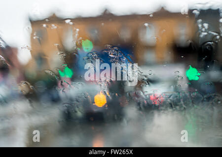 Blurred picture of traffic through a car windscreen during heavy rain. Stock Photo
