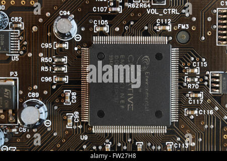 Close up of integrated circuit on printed circuit board assembly technology soundcard computer component Stock Photo