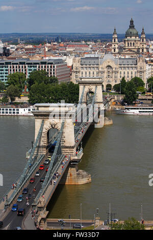 Chain Bridge over the Danube, Budapest, Gresham Palace and St. Stephen's Basilica, Pest, Budapest, Hungary Stock Photo