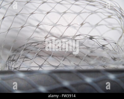 Closeup net and shadow on black leather surface Stock Photo