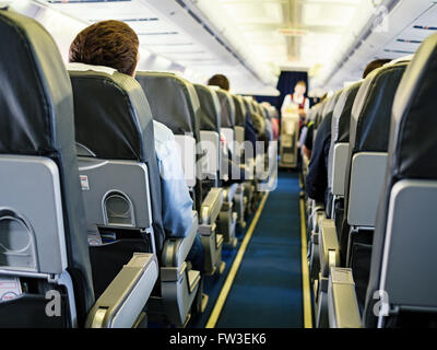Cabin of passenger aircraft during the flight, shallow depth of field Stock Photo
