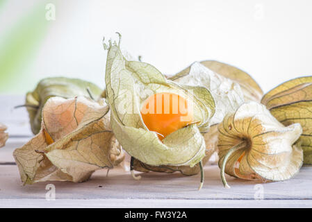 Physalis peruviana fruit on a wooden table Stock Photo