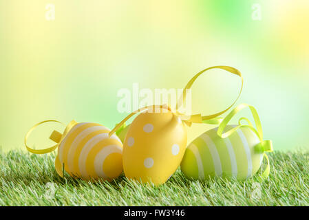 Easter eggs with patterns on green turf in the spring Stock Photo