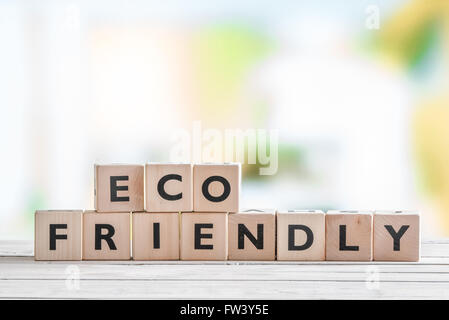 Eco friendly sign on a wooden table in nature Stock Photo