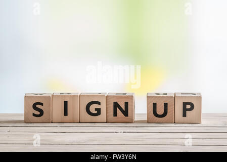 Cubes with the message sign up on a table Stock Photo