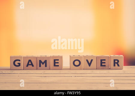Game over sign on a table in retro colors Stock Photo
