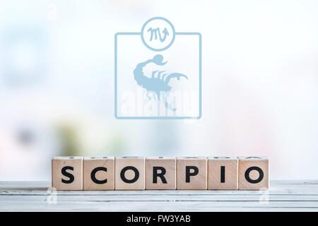 Scorpio star sign on a wooden table Stock Photo