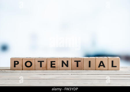 Potential word made of wooden cubes on a table Stock Photo