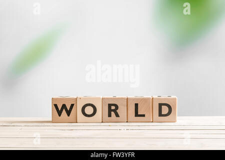 World sign made of cubes on a wooden table Stock Photo