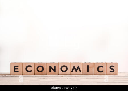 Economics sign made of blocks on a desk Stock Photo