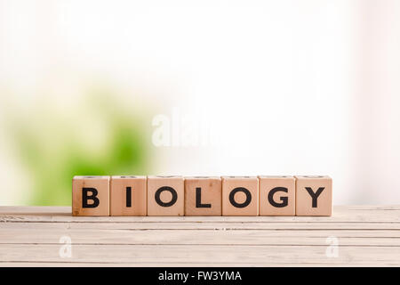 Biology sign made of wood on a table in the nature Stock Photo