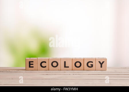 Ecology sign on a wooden desk in the nature Stock Photo