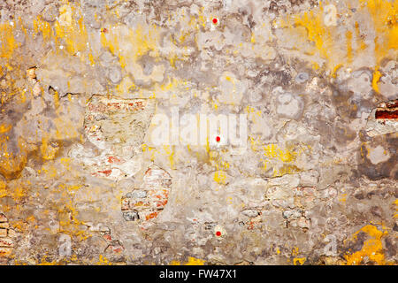Image of cracked painted brick wall. Abstract background. Stock Photo
