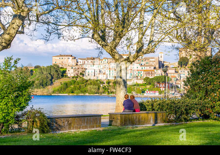 old ladies chatting on river shore in Italy - Capodimonte - Lazio - Viterbo Stock Photo