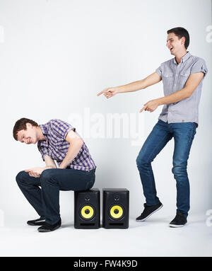 two funny boys with speakers Stock Photo