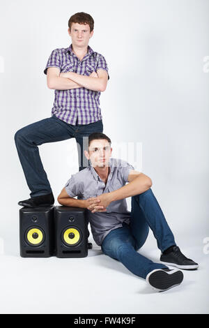 two funny boys with speakers Stock Photo