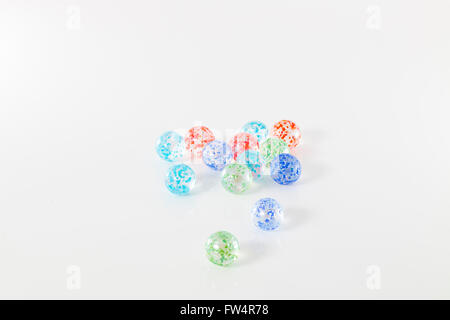 colored marbles, isolated on white studio background Stock Photo