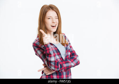 Happy woman showing finger at you and winking isolated on a white background Stock Photo
