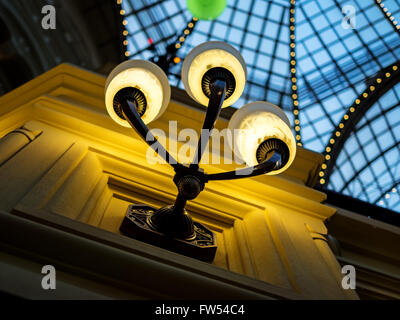 Illuminated sconces in a classic interior, shallow depth of field Stock Photo