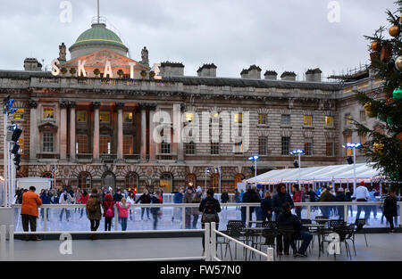 People enjoying the Ice Skating Rink at Somerset House in London, England Stock Photo