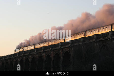 The Bath Christmas Market train hurries south over the Ouse Valley Viaduct and catches the early morning light Stock Photo