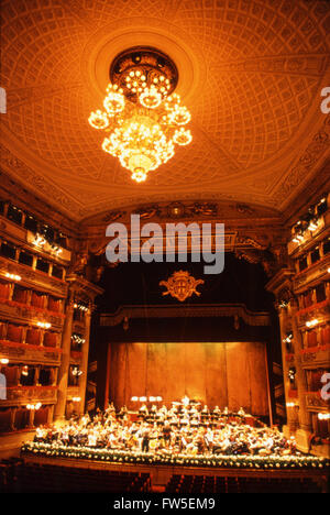 La Scala, Milan - Interior view to orchestra on stage. Chandelier and boxes also pictured. Philharmonia Orchestra in rehearsal, Stock Photo