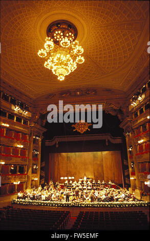 La Scala, Milan - Interior view to orchestra onstage. Chandelier and boxes also pictured. Philharmonia Orchestra in rehearsal, Stock Photo