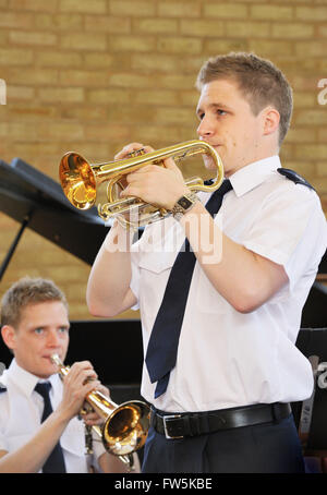 Cornet soloist with Salvation Army Band playing before a service. Hendon, London NW4. In summer shirt-sleeves uniform. Continuing the high standards of British brass band playing. Stock Photo