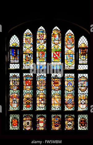 the great window of Middle Temple Hall, London Inns of Court, dated 1570, with shields of nobility including Thomas Dudley, Thomas Walcot, John Shurley. The Hall was built in 1570, with a High Table presented by Queen Elizabeth I, and where the first performance was given, 1602, of Shakespeare's Twelfth Night. The Temple was widely described by Charles Dickens in such novels as Barnaby Rudge, Great Expectations, and Our Mutual Friend. Stock Photo
