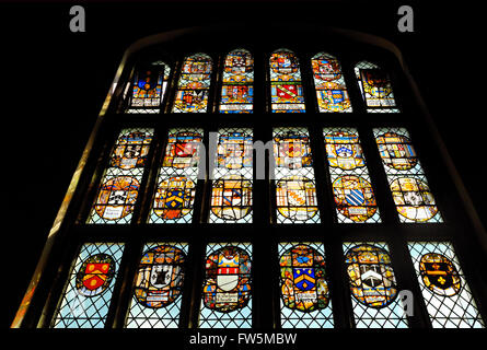 the great window of Middle Temple Hall, London Inns of Court, dated 1570, with shields of nobility including Thomas Dudley, Thomas Walcot, John Shurley. The Hall was built in 1570, with a High Table presented by Queen Elizabeth I, and where the first performance was given, 1602, of Shakespeare's Twelfth Night. The Temple was widely described by Charles Dickens in such novels as Barnaby Rudge, Great Expectations, and Our Mutual Friend. Stock Photo
