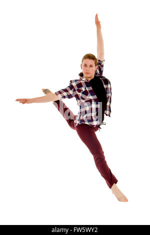 Skilled Male Lyrical or Contemporary Dancer Leaps in a Jete with a bit of attitude Stock Photo