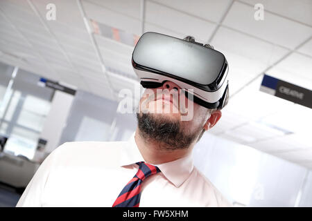 virtual reality headset worn by mature man Stock Photo