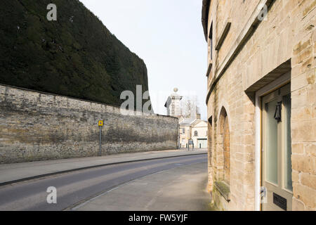 Park Lane on the one way system with the wall of the Bathurst Estate in Cirencester, Gloucestershire, UK Stock Photo