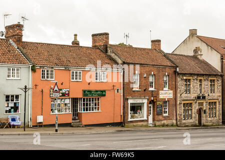 Retail outlets / shops at the top end of Glastonbury High Street. Stock Photo