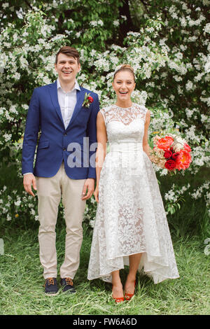 Newlyweds laugh wedding couple Beautiful bride and groom. Just married Stock Photo