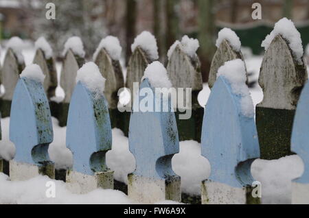 Wooden fence covered in snow Stock Photo - Alamy