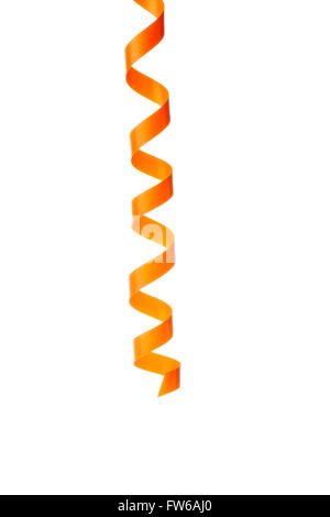 Close-up shot of orange streamer against plain white background. Stock Photo