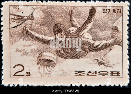 CHINA - CIRCA 1966: A stamp printed in China shows paratrooper in fall, circa 1966 Stock Photo