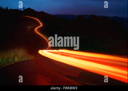 Streaking Car Tail Lights on Road at Night. Kawaii, Hawaii, U.S.A. Stock Photo