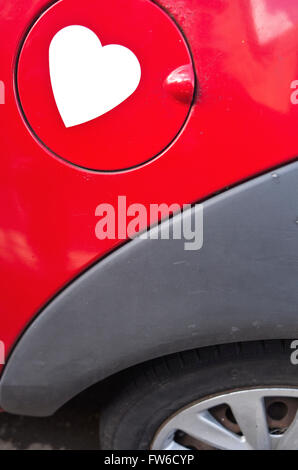 A fuel cap emblazoned with a heart sticker. Stock Photo