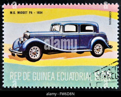 EQUATORIAL GUINEA - CIRCA 1974: A stamp printed in Guinea dedicated to vintage cars, shows MG Midget, 1934, circa 1974 Stock Photo